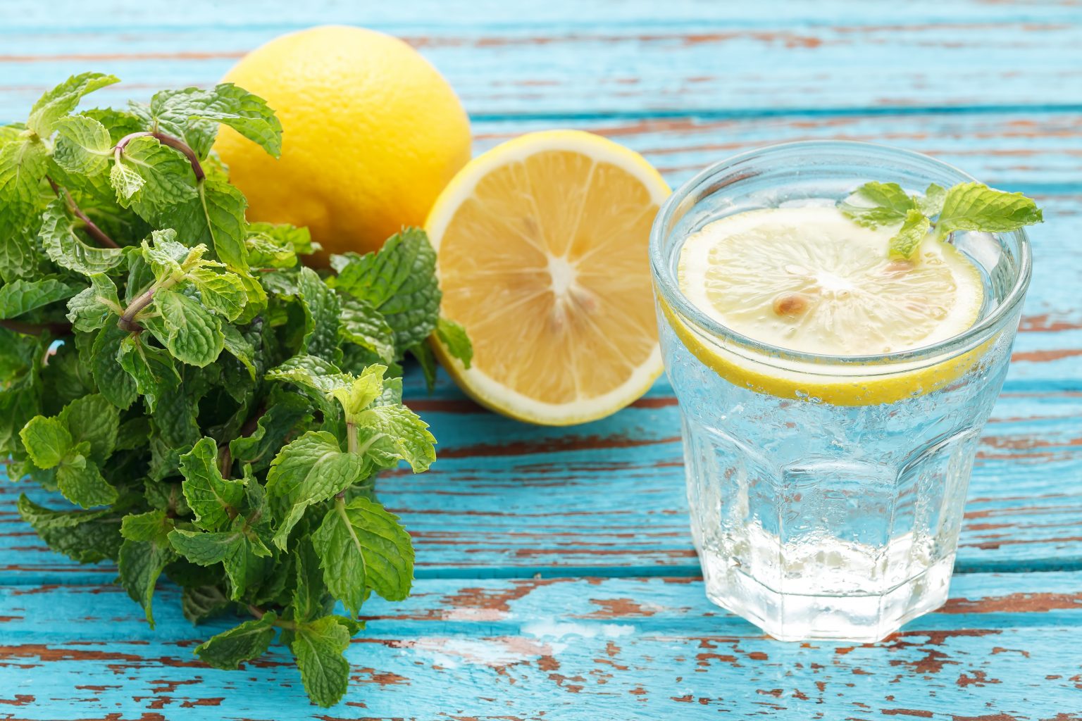 lemon soda mint fresh drink summer refreshment still life blue background wood teak