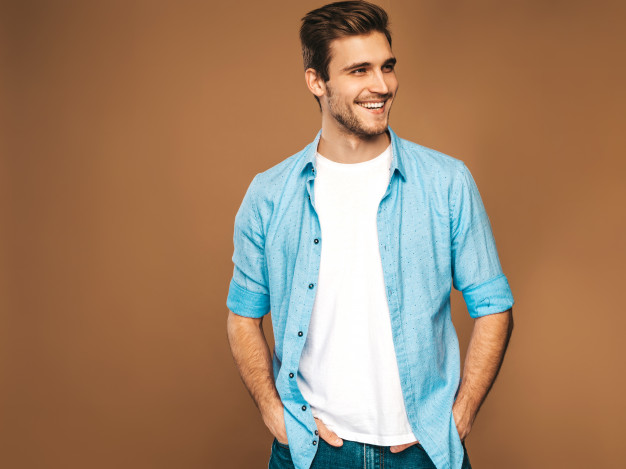 portrait-handsome-smiling-stylish-young-man-model-dressed-blue-shirt-clothes-fashion-man-posing_158538-4976